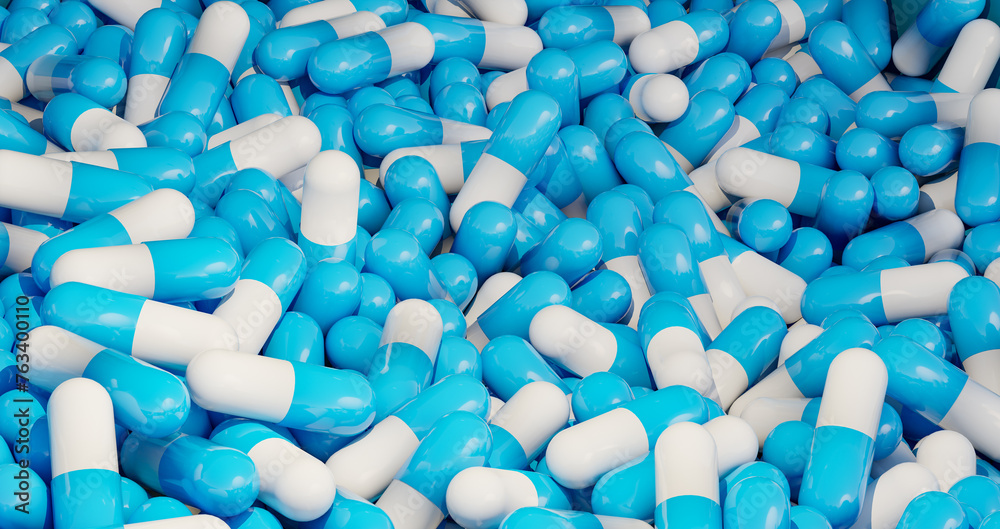 Blue medical pills, capsules in a box. Industrial production of medicine, antibiotica or other drugs. Blue medical pills, capsules in a box. Industrial production of medicine, antibiotica or other drugs.