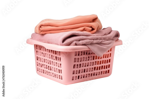 Clothes and towel in laundry plastic basket isolated on transparent background.