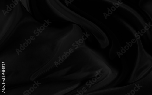 Black gray satin dark fabric texture luxurious shiny that is abstract silk cloth background with patterns soft waves blur beautiful.