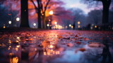 Wet autumn leaves on the ground with city lights reflection. Seasonal urban concept.
