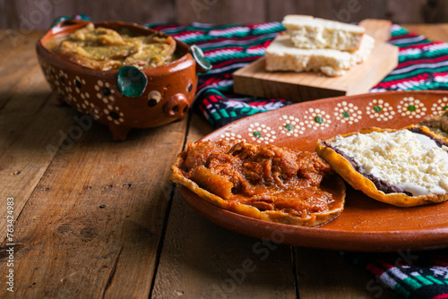 Sopes of chicharron in green sauce and red sauce. Mexican food. photo