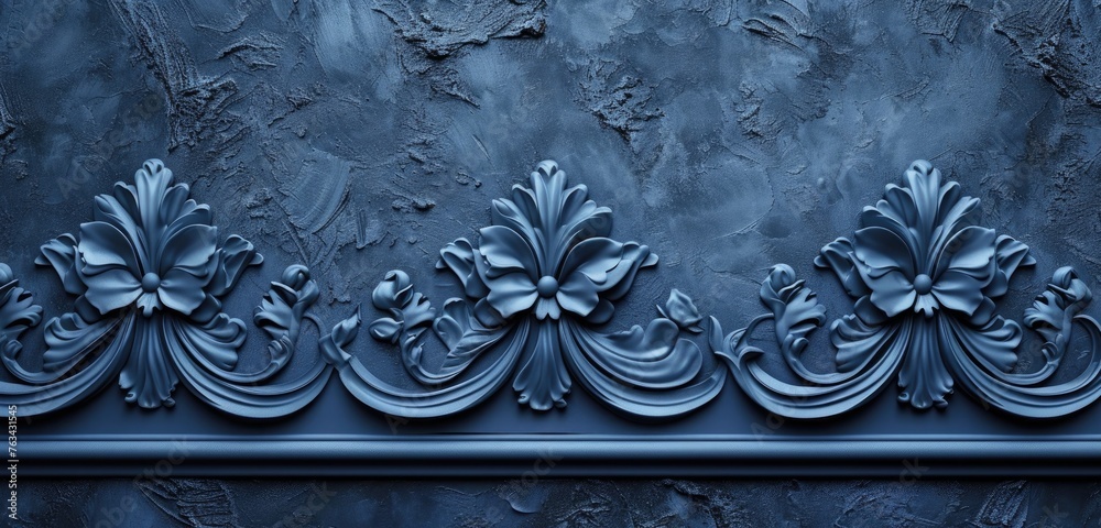 Decorative relief on a textured navy blue stucco wall. Wide-angle shot, abstract patterns. Steel blue background.