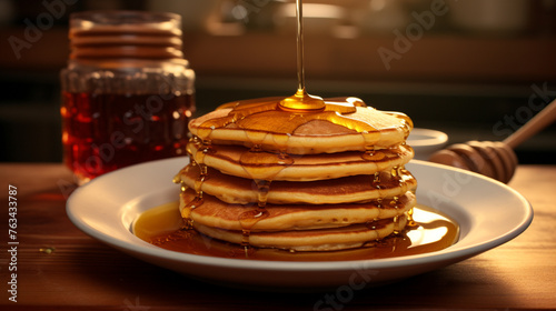 A  photograph of a stack of fluffy pancakes drizzled with maple syrup, placed on a warm, honey-colored plate.