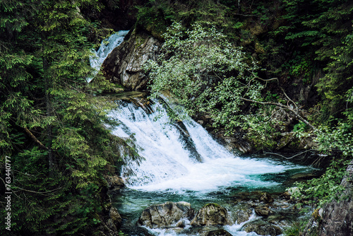 Wodogrzmoty Mickiewicza waterfall flowing down from high mountains in polish Tatras photo