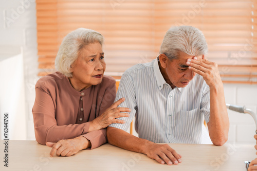 Caring for Future, Elderly Asian Couple Consults Healthcare Professional, Navigating Health Concerns with health Insurance Support photo