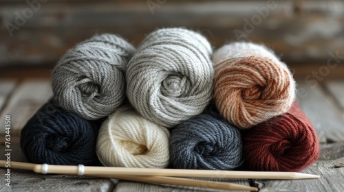 Skeins of wool yam and knitting needles