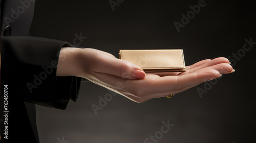 Hand of a businesswoman holding a blank empty mockup business card.