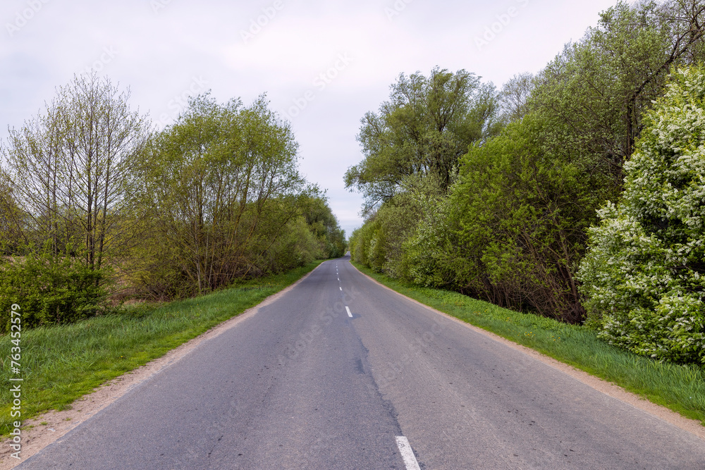 windy cloudy weather and highway in rural areas windy cloudy weather and highway in rural areas