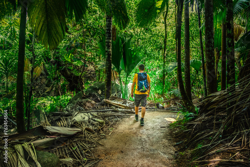 Man on a dirt path exploring the jungle © Gabriele Maltinti