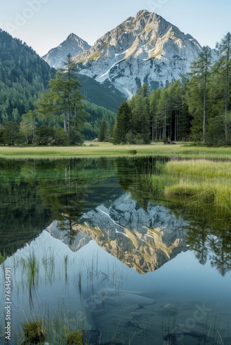 A mountain range is mirrored in the calm waters of a lake  creating a stunning natural reflection