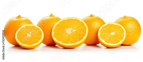 Five halved oranges, one orange among citrus
