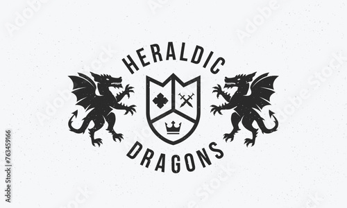 Dragons crest logo. Dragons vintage logo. Vintage crest logo with heraldic Dragons and grain texture. Trendy hipster design. Vector illustration