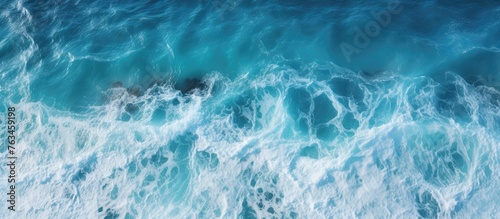 Aerial view of ocean wave crashing on rocks © Ilgun