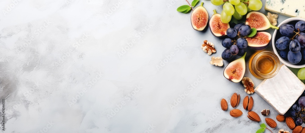 Plate of assorted fruits nuts on table - obrazy, fototapety, plakaty 