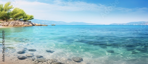 Morning view of rocky beach with crystal clear water