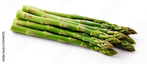 Fresh asparagus spears on white surface