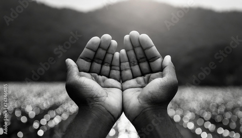 Faith concept- Black and white muslim prayer open two empty hands with palms up for pray photo