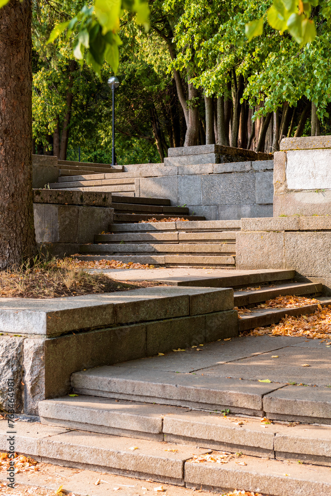 Granite steps in the rays of the autumn sun. Beautiful sunny landscape. Granite steps in the rays of the autumn sun. Beautiful sunny landscape.