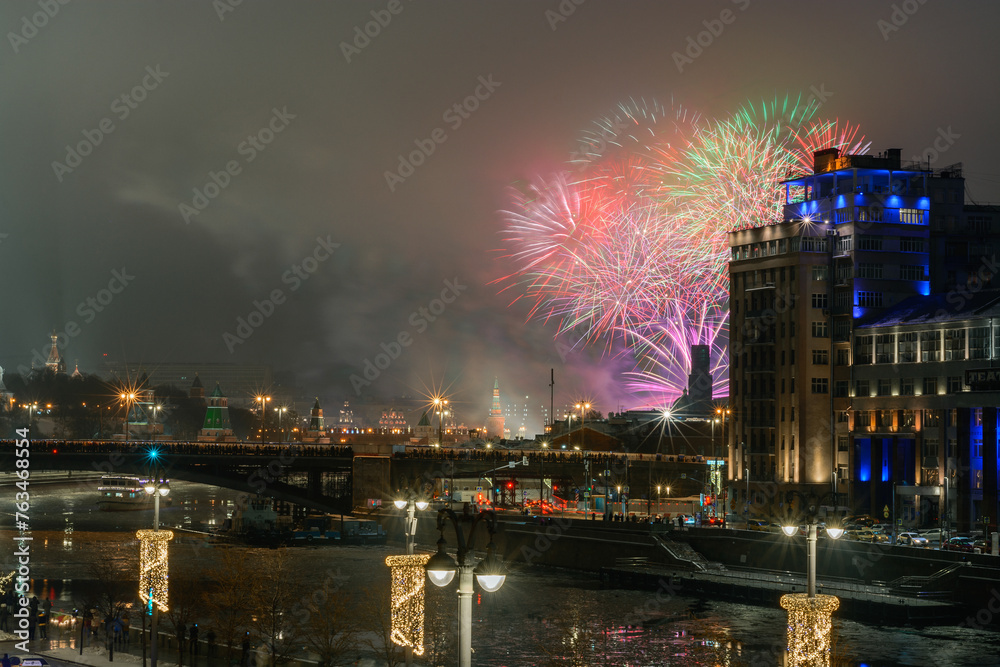 New Year fireworks over the river at night in Moscow