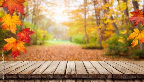 a wooden board in front of an autumn themed background