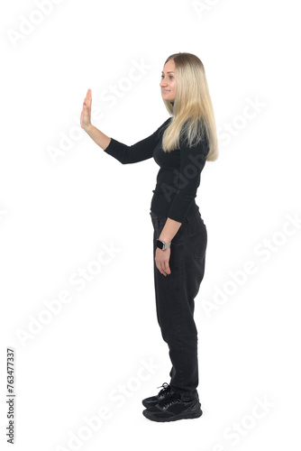 side view of standing woman greeting on white background