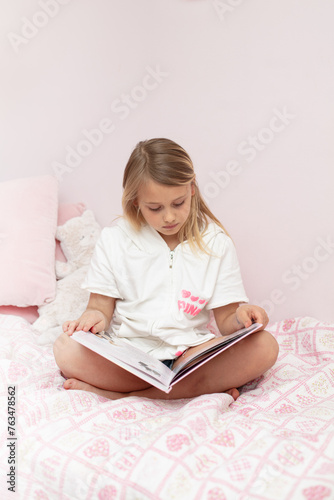 little girl reading a book
