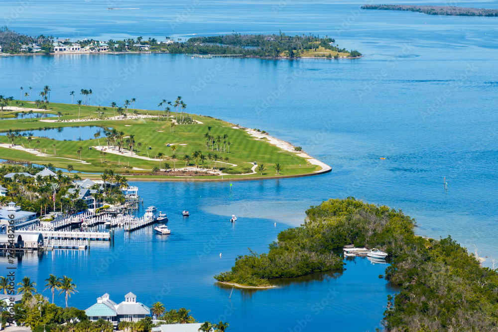Large golf course and sports grounds with green grass in Boca Grande, small town on Gasparilla Island in southwest Florida