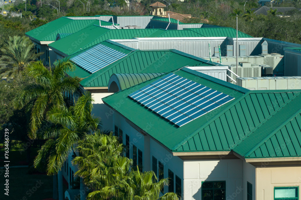 View of Residential apartment building with rooftop covered with solar ...