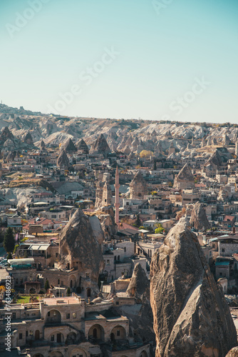 Sunrise over the epic Goreme, Cappadocia (Kapadokya) National Park, with incredible rock formations and mosque towers