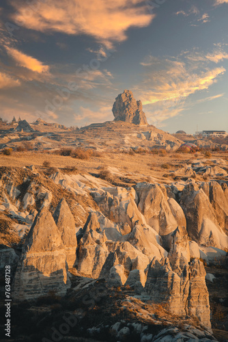 Sunset over the epic Goreme, Cappadocia (Kapadokya) National Park, with orange skies and rock formations