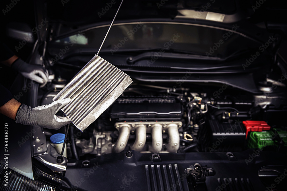 Car air conditioner system maintenance, Hand mechanic holding car air filter to check for clean dirty or fix repair heat have a problem or replace new or change filter. - obrazy, fototapety, plakaty 