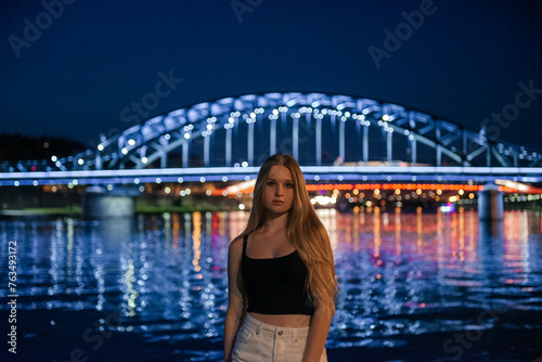 Portrait of a Young Woman with the Illuminated Jozef Pilsudski Bridge, Krakow