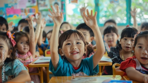 A lot of children raise their hands in a kindergarten. Children who are interested in answering questions.