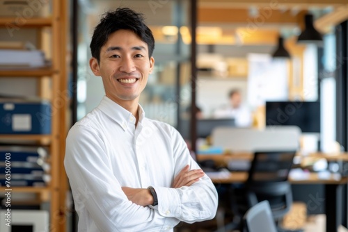 Japan business man smiling standing arms crossed looking at camera in modern Office Business Confident Work for Background Corporate