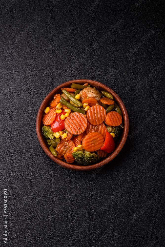 Delicious healthy vegetables steamed carrots, broccoli, asparagus beans and peppers
