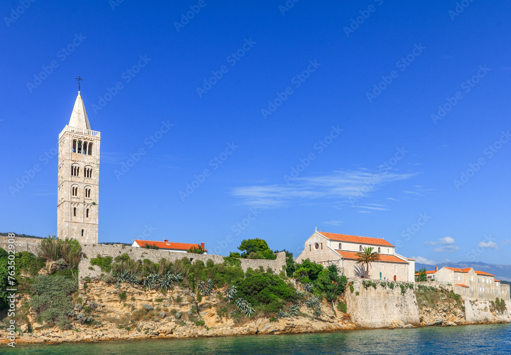 View from the boat over the old town of Rab, historic four church towers, symbol of the city