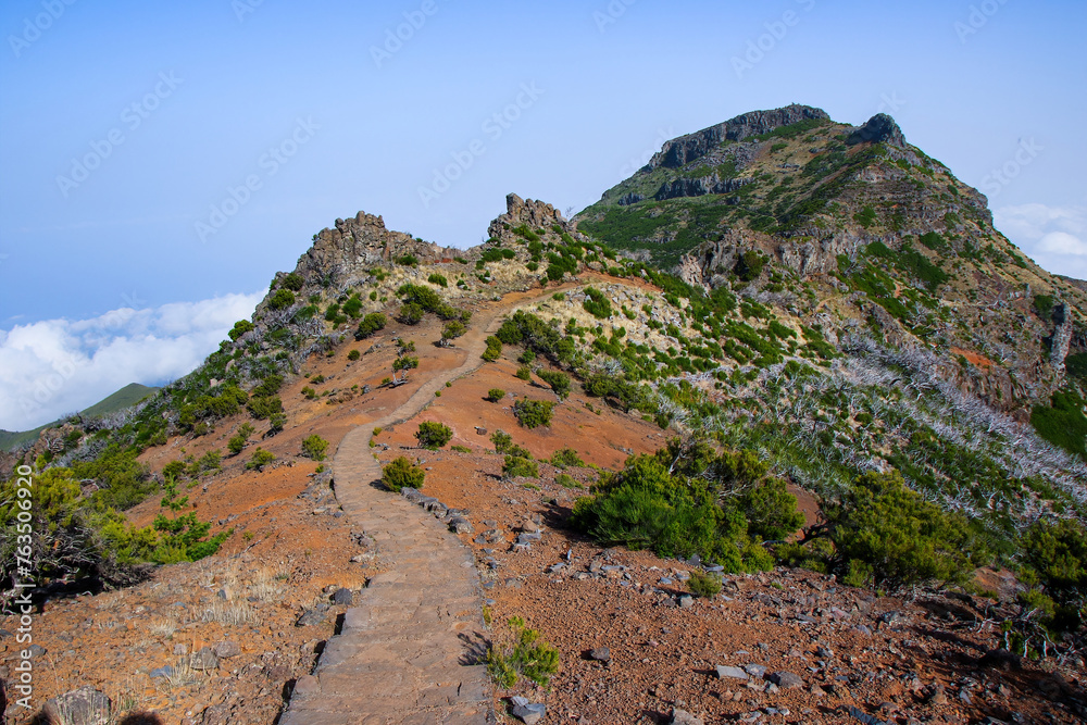Paved footpath of the PR 1.2 trail climbing to the Pico Ruivo, the highest mountain peak on Madeira island (Portugal) in the Atlantic Ocean Paved footpath of the PR 1.2 trail climbing to the Pico Ruivo, the highest mountain peak on Madeira island (Portugal) in the Atlantic Ocean