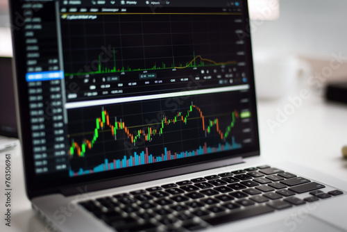 Financial stock market on a laptop screen. Stock market curve on screen. Investing in the stock market. Sotck exchange. Stock market training.