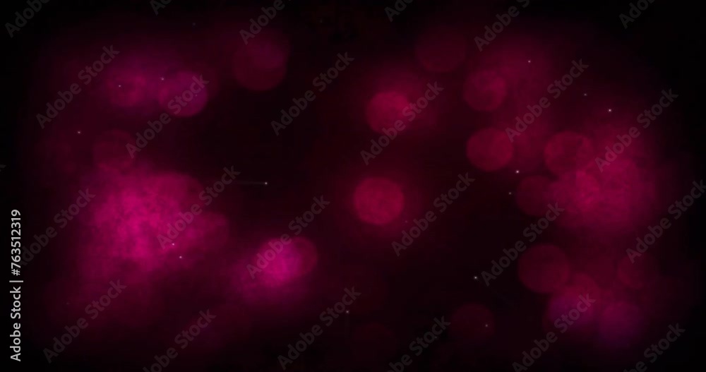 Animation of light spots and shapes moving on black background
