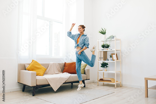 Joyful Woman Jumping and Dancing in a Playful Indoor Home Concept