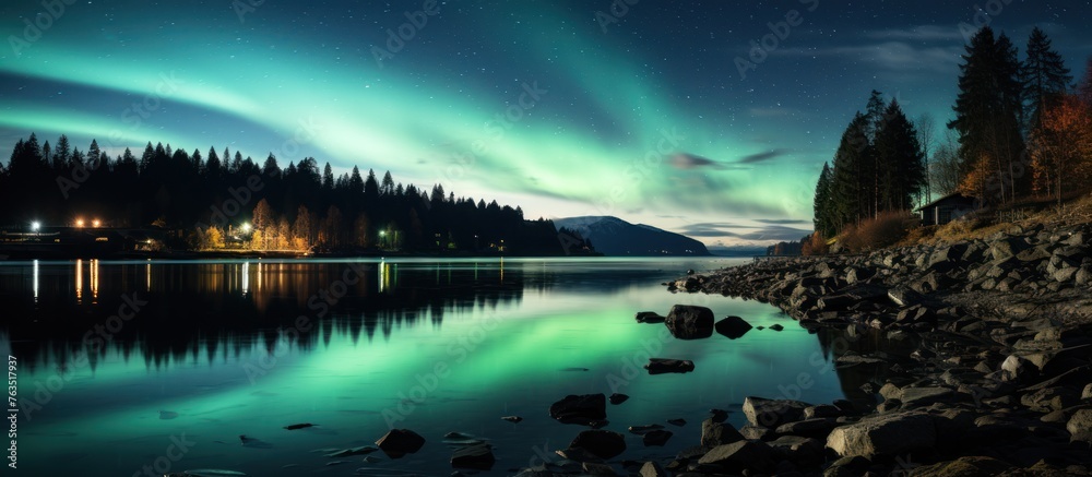 Aurora borealis, northern lights over the lake at night