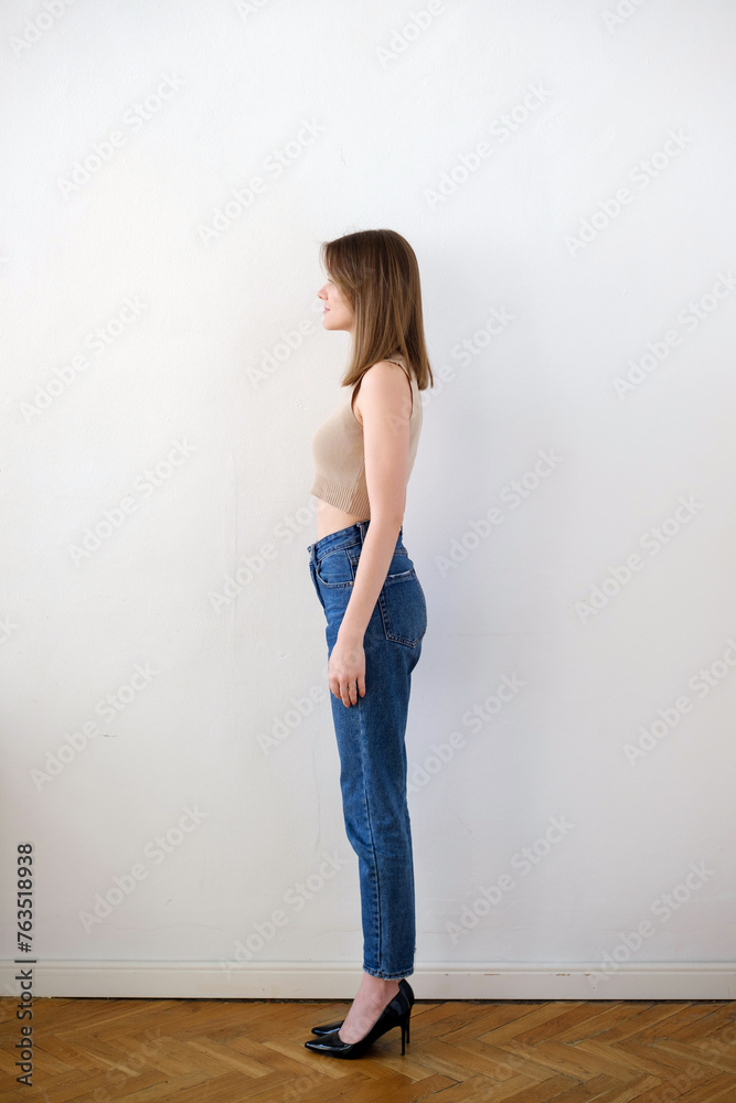 Young girl in black t-shirt model snap left look close up on white background
