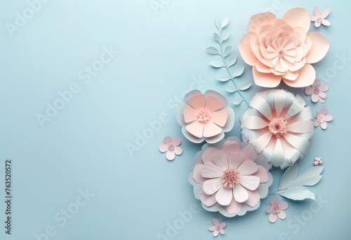 Beautifully crafted paper flowers and leaves arranged symmetrically on a calming pastel blue backdrop © Nikola