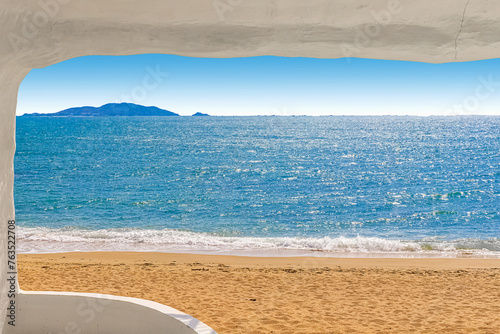 Beach at World's End Park, Sanya, China. View of the beautiful beach and sea from the white bungalow photo