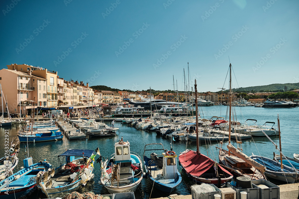 yacht harbor of beautiful Saint Tropez along the coastline of the mediterranean sea of the french riviera on a sunny day.