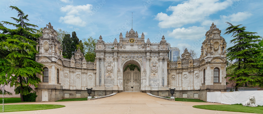 Gate at former Ottoman Dolmabahce Palace, or Dolmabahce Sarayi, suited in Ciragan Street, Besiktas district, Istanbul, Turkey. View from the internal court