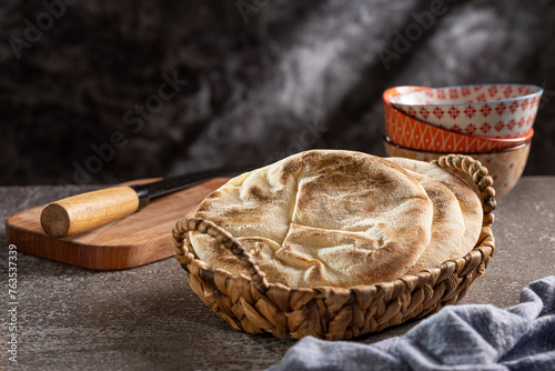 Pita bread on the table. Arabic lebnani bread. photo