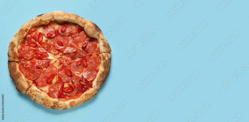 Delicious pepperoni pizza on light blue background with space for text, top view Delicious pepperoni pizza on light blue background with space for text, top view