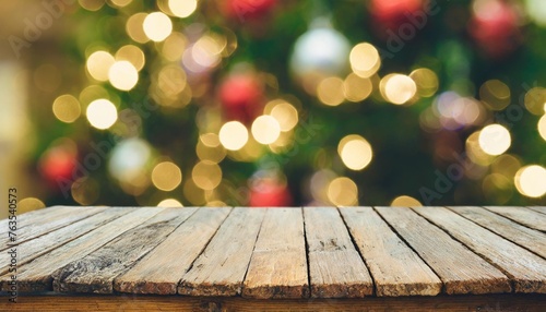 empty wooden table in front of abstract blurred christmas light background for product display in a coffee shop local market or bar