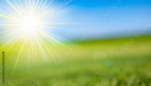 sun shine on summer landscape banner empty background green field and blue sky blur nature template defocus abstract sunny day open air